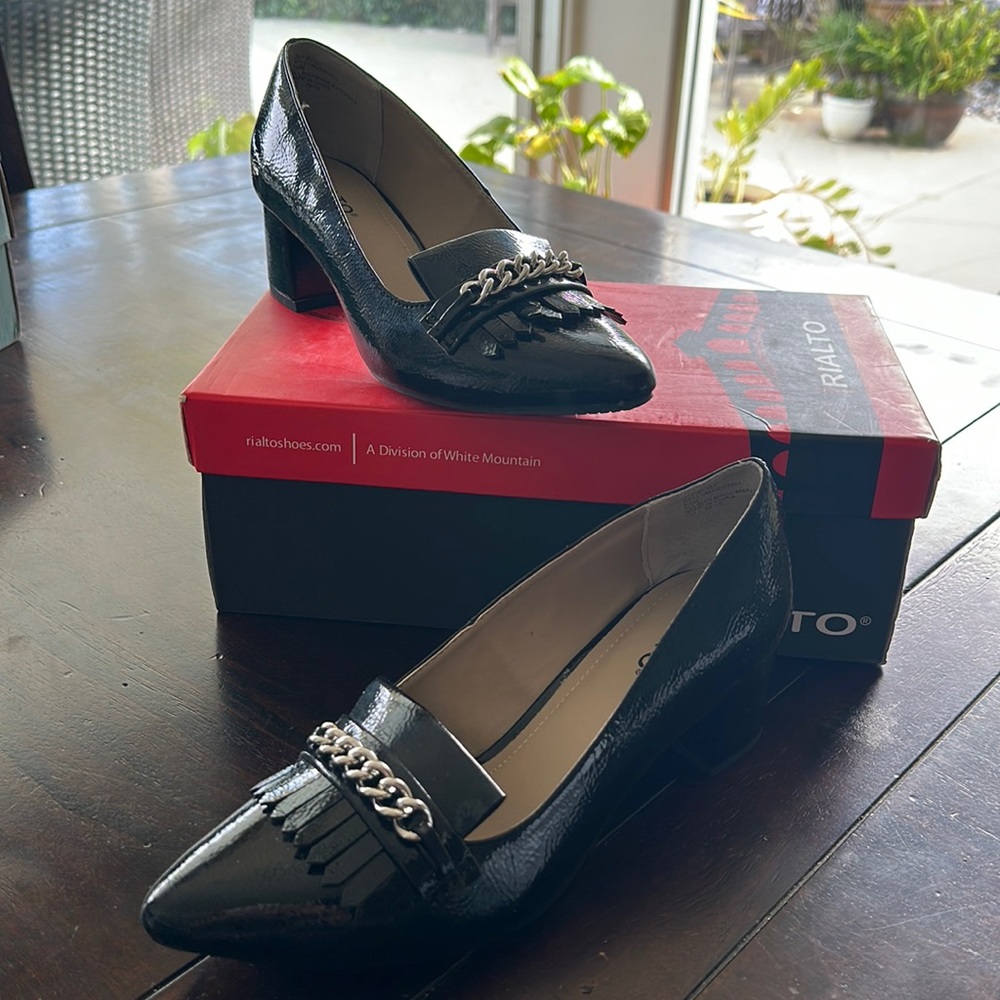 New, never worn patent heel.